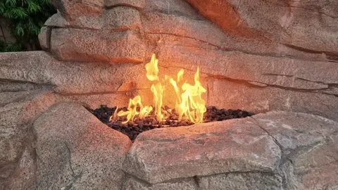 Close-Up of Flames in Stone Gas Fireplace Stock Footage 312532200
