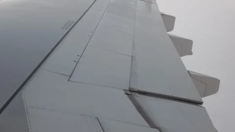 Close-up: the flaps of a plane flying at sunset. Stock Footage 332618383