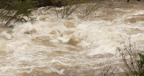 Close up flash flood flows after a heavy rainstorm. Stock Footage 281059600