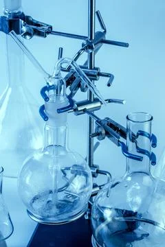 Close up flask on a tripod. Laboratory analysis equipment. Chemical laborator Stock Photos