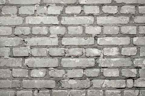 Close-up of flat brick wall with rows of cement concrete bricks as background Stock Photos