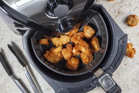 Close up flat lay image of an air fryer oven on kitchen countertop. This offe Stock Photos