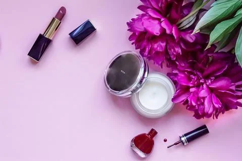 Close-up flat lay on pink background with place for text beauty products Stock Photos
