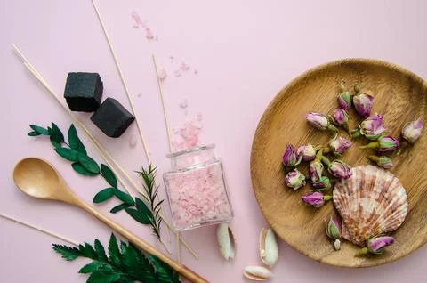 Close-up Flat Lay SPA objects in a Wooden plates rose flowers buds and leaves Stock Photos