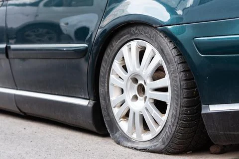 Close-up of a flat tire of a rusty old car. Russia, Rostov-on-Don 23may2022 Stock Photos