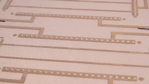 Close-up of a flexible PCB with conductive silver paste, showing precise Stock Footage 300837787