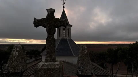 Close-up flight with drone view towards the bell tower and Christian cross of Stock Footage 261383278