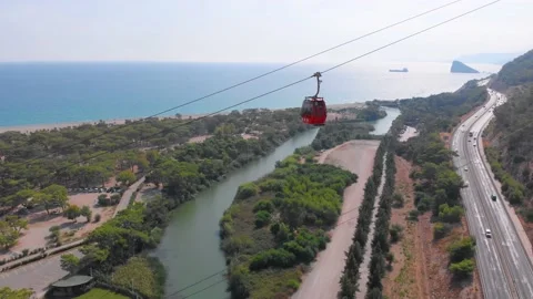 Close-up flight next to the uphill funicular with the coast in the background 4K Stock-Footage 143915407