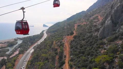 Close-up flight next to the uphill funicular with the coast in the background 4K Stock-Footage 143915866