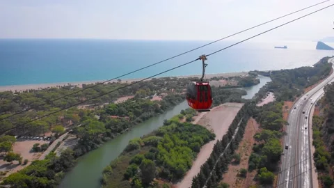 Close-up flight next to the uphill funicular with the coast in the background 4K Stock-Footage 143915899