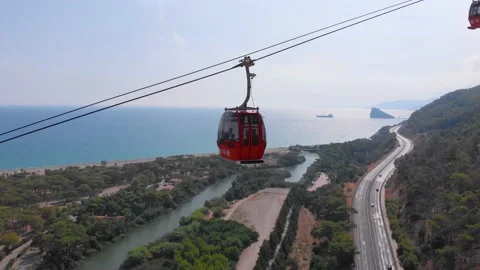 Close-up flight next to the uphill funicular with the coast in the background 4K Stock-Footage 143915962