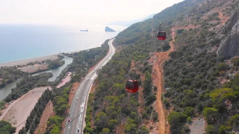 Close-up flight next to the uphill funicular with the coast in the background 4K Stock-Footage 143916062