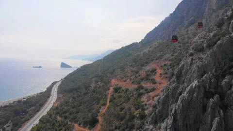 Close-up flight next to the uphill funicular with the coast in the background 4K Stock-Footage 143916271