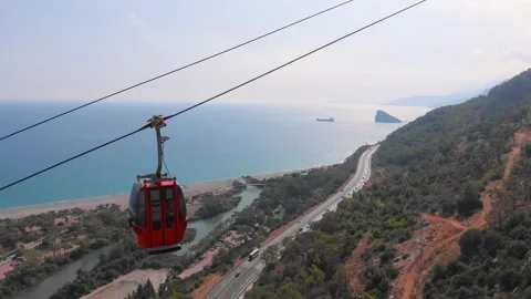 Close-up flight next to the uphill funicular with the coast in the background 4K Stock-Footage 143916415