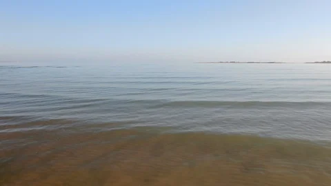 Close flight over the blue sea. Calm sea. Stock-Footage 125239694