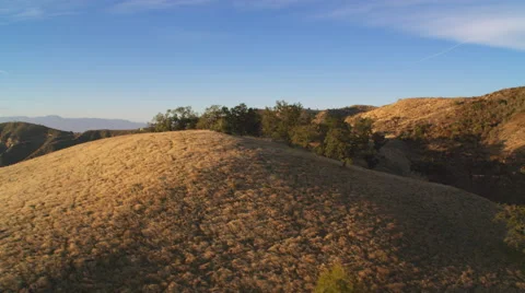 Close flight over brushy rounded hills in the San Gabriel Mountains, California. Stock Footage 59106552
