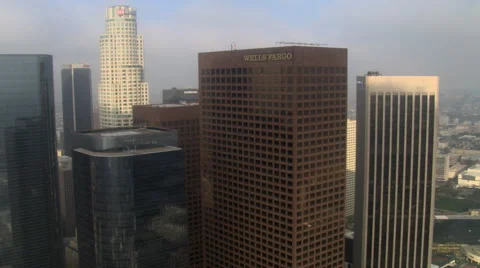 Close flight past Los Angeles skyscrapers under hazy skies. Shot in 2008. Stock Footage 59511802