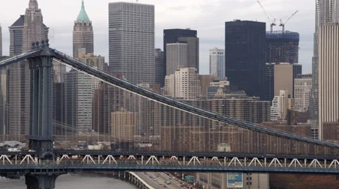 Close flight past the Manhattan Bridge toward Brooklyn, looking back at Lower Stock Footage 59165308