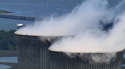 Close flight past nuclear cooling tower tops Stock Footage 59474660