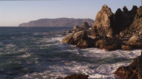 Close flight past rocks on the rugged Catalina coast. Shot in 2010. Stock Footage 59118647
