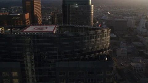 Close flight past Wells Fargo building and others with Los Angeles cityscape Stock Footage