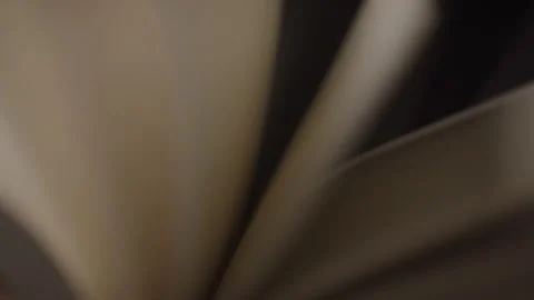 Close-up of Flipping Blurred Book Pages Under Studio Light Stock Footage 222008253