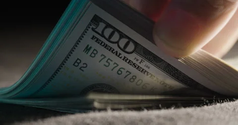 Close-up Flipping Through Stack Of U.S. Dollars Video stock 139017771