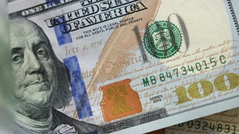 Close-up flipping through stack of U.S. Hundred dollar bills. Stock Footage 242936051