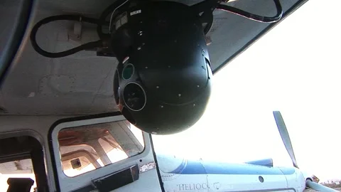 CLOSE-UP OF FLIR MOUNTED ONTO SHERIFF DEPT. SURVEILLANCE PLANE Stock Footage 170578407