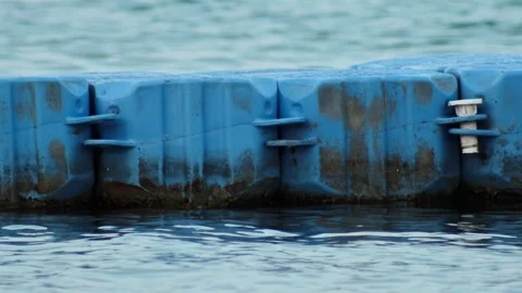 Close up floating dock, synthetic jetty. Plastic pontoon pier marina, dirty Stock Footage 308009059