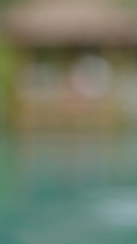 Close up, Floating inflatable ball in clear pool. A view of colorful floating Stock-Footage 308929818