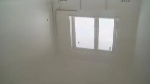 Close up of floor leveling process. Liquid mortar creates a smooth, reflectiv Stock Photos