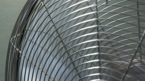 Close-up of floor-standing fan metallic grill 4K video Stock Footage 158659108