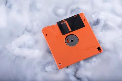 Close-up floppy disk in the clouds Stock Photos