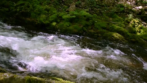CLose up of a flowing cascade of a mountain river. Video stock 155128065