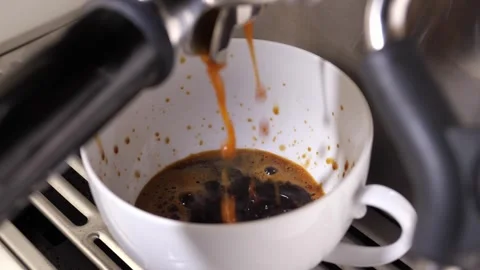 Close-up flowing fresh ground coffee. Pour coffee stream from the professional Stock Footage 259820946
