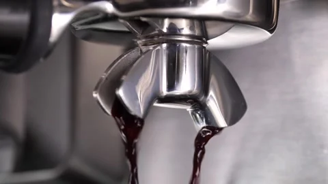 Close-up flowing fresh ground coffee. Pour coffee stream from the professional Video stock 265257120