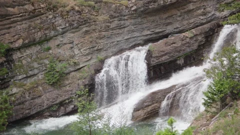 Close up of flowing water on Cameron falls in Canada Video stock 312902865