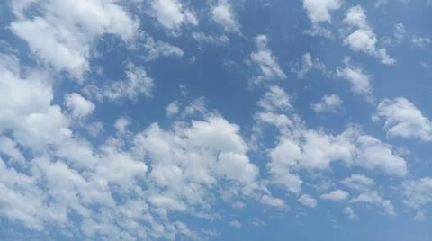 Close-up of fluffy cumulus clouds on a clear day Stock Photos
