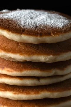Close up of fluffy pancake stack texture with sugar dust 스톡 사진