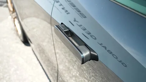 Close-up of flush door handle on Zeekr 7GT electric vehicle, highlighting sleek Stock Footage 335322115