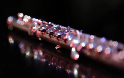 Close up flute selective focus bokeh in theater during concert Stock Photos