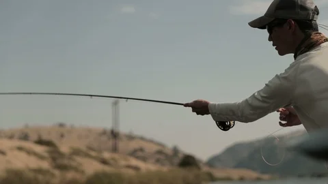 Close Up Fly Fisherman Casting Fly Rod on Drift Boat Stock Footage 95908365
