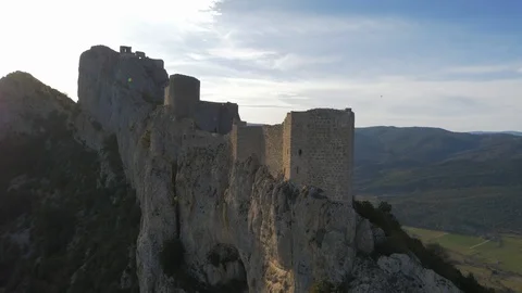 Close fly over Chateau De Peyrepertuse with dramatic cliff faces Stock Footage 102517257