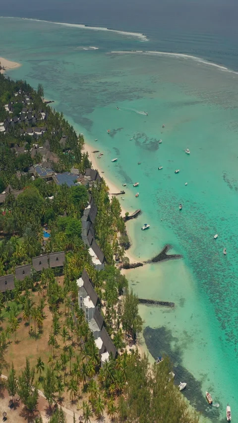 Close up fly over palm trees and beautiful beach lagoon. Paradise island in Stockbeeldmateriaal 271665572