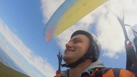 Close up of fly paragliders. Men Stock Footage 71892250