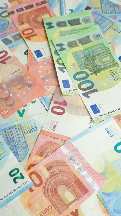 Close up of flying Euro banknotes over a pile of cash. Stock Footage 331448762