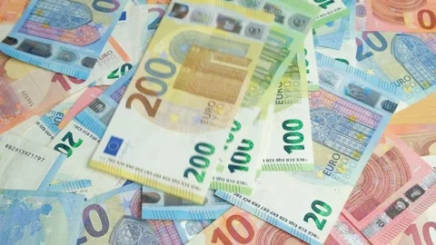 Close up of flying Euro banknotes over a pile of cash. Stock Footage 335227854