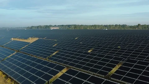 Close-up flying over the Solar Panels of large solar power plant Stock Footage 113395100