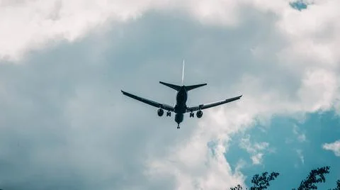 Close flying plane in the sky Photos